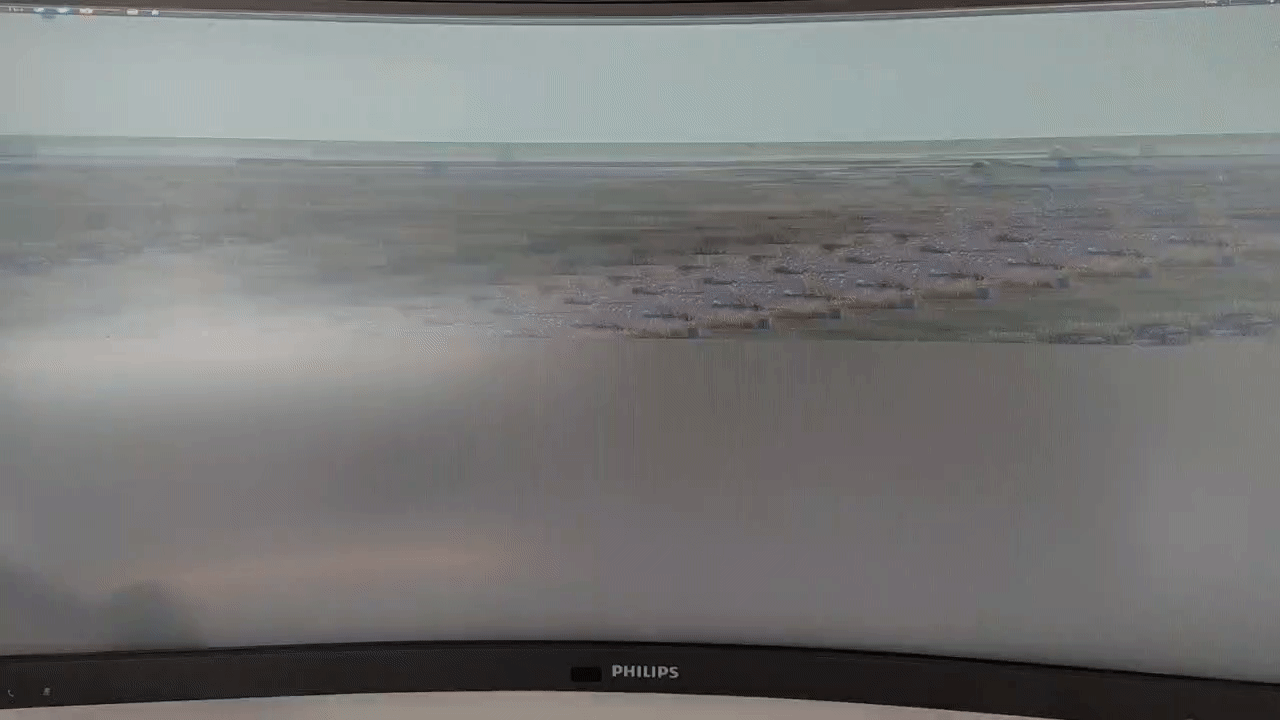 A GIF of a monitor showing artifacts and glitches across the whole screen